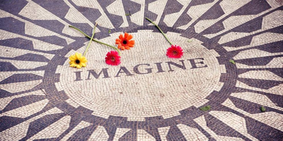 imagine written on ground with flowers