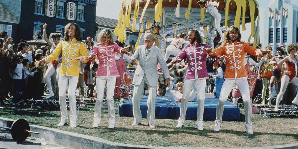 Actors on stage playing the beatles in the first ever beatles musical