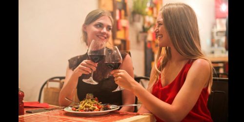 pasta and wine eating dinner via pexels by Andrea Piacquadio