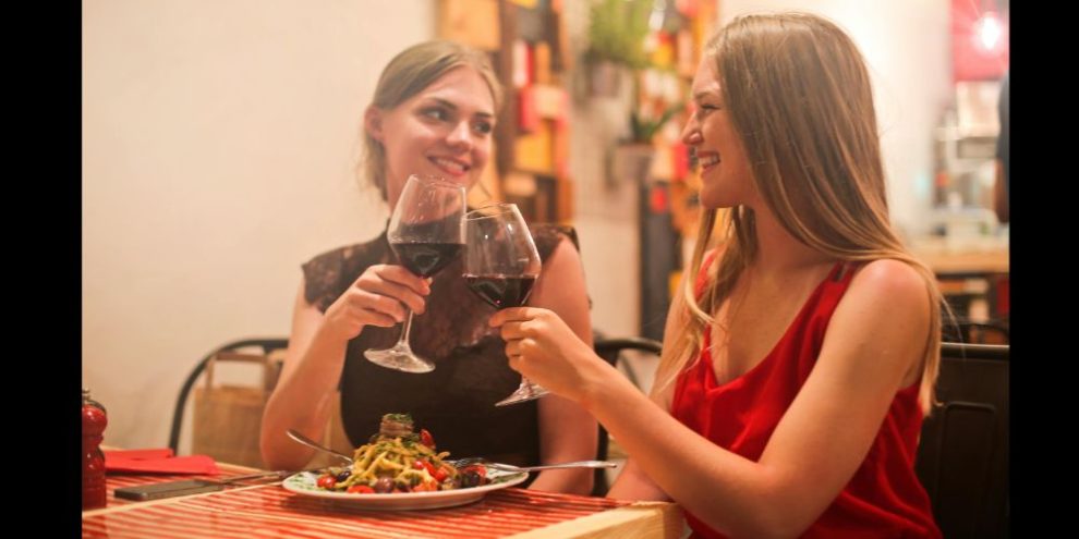 pasta and wine eating dinner via pexels by Andrea Piacquadio