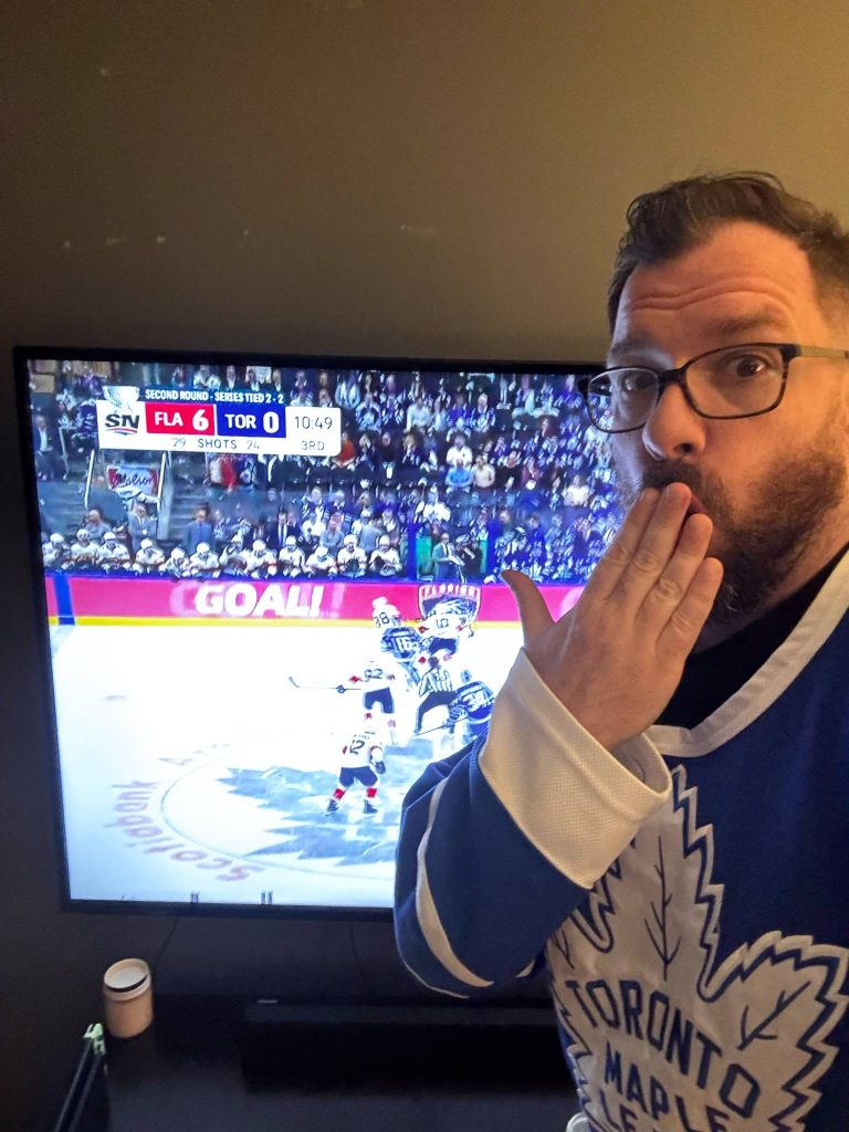 McCully from Rock 95 wearing a Toronto Maple Leafs jersey