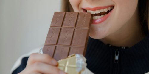 woman eating chocolate from pexels by RDNE Stock project